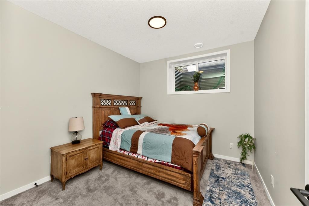 23 Lucas Boulevard Nw, Calgary, AB - Indoor Photo Showing Bedroom