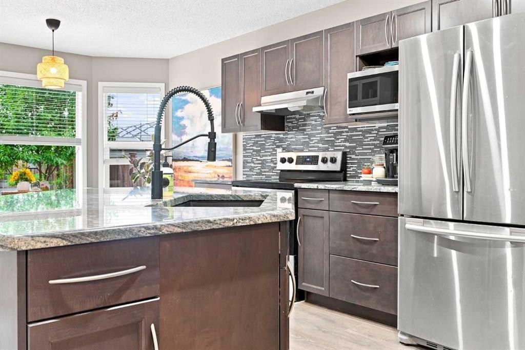 106 Autumn Crescent Se, Calgary, AB - Indoor Photo Showing Kitchen With Stainless Steel Kitchen With Upgraded Kitchen