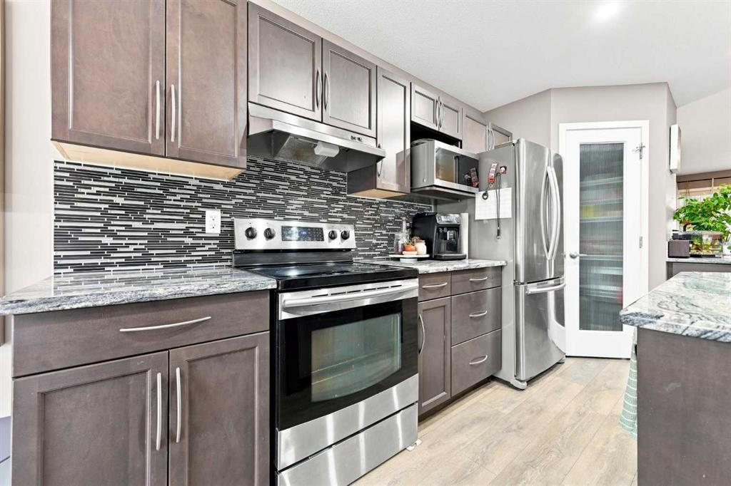 106 Autumn Crescent Se, Calgary, AB - Indoor Photo Showing Kitchen With Stainless Steel Kitchen With Upgraded Kitchen
