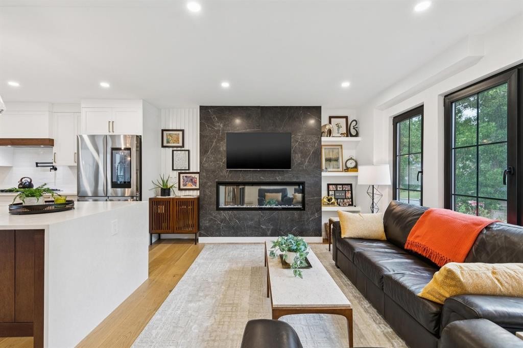 2543 Chicoutimi Drive Nw, Calgary, AB - Indoor Photo Showing Living Room With Fireplace