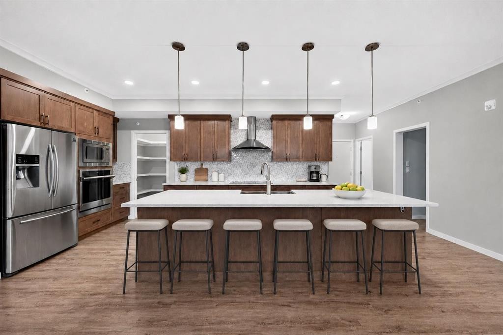 406-4350 Seton Drive Se, Calgary, AB - Indoor Photo Showing Kitchen With Stainless Steel Kitchen With Upgraded Kitchen