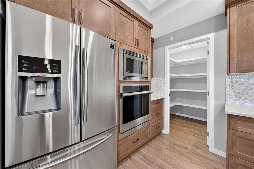 406-4350 Seton Drive Se, Calgary, AB - Indoor Photo Showing Kitchen With Stainless Steel Kitchen