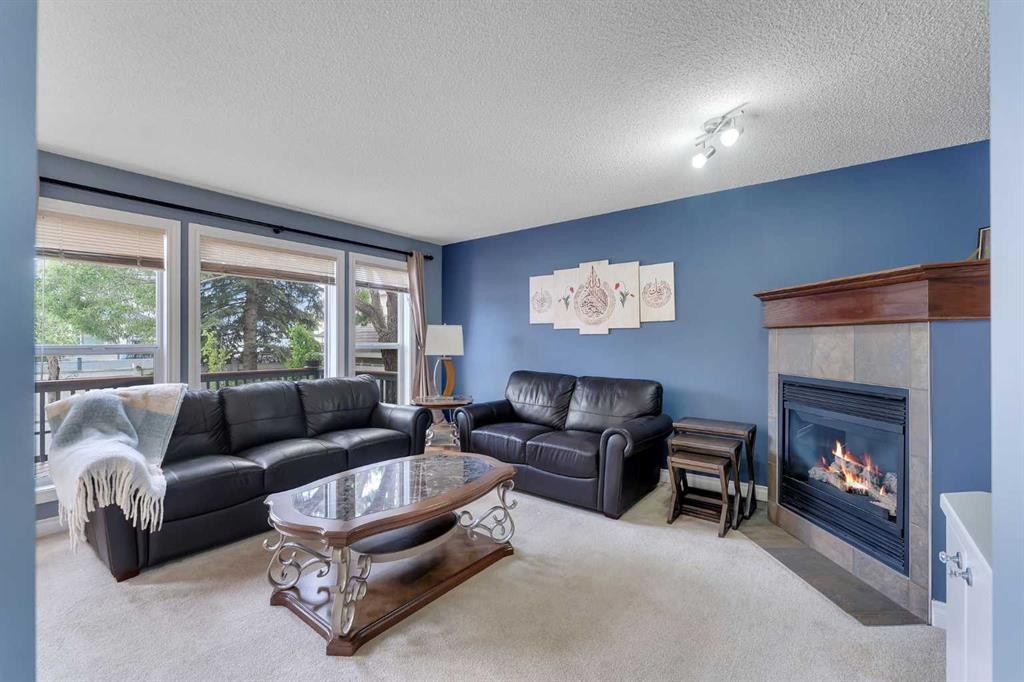 169 West Creek Boulevard, Chestermere, AB - Indoor Photo Showing Living Room With Fireplace
