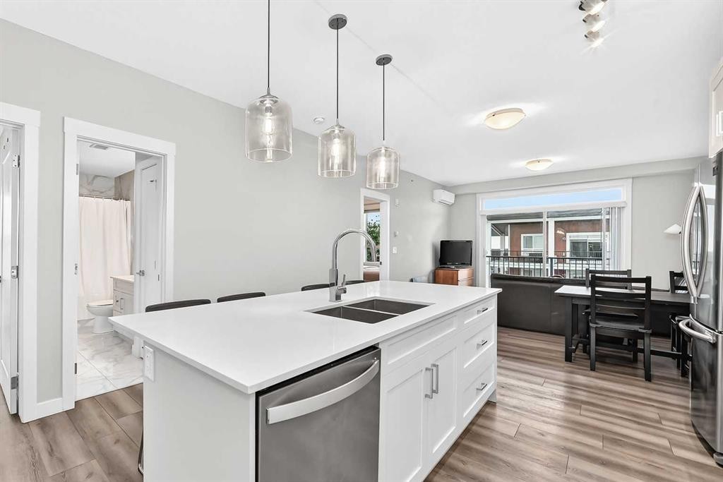 409-30 Walgrove Se, Calgary, AB - Indoor Photo Showing Kitchen With Double Sink With Upgraded Kitchen