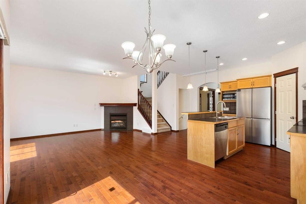 57 Everoak Circle Sw, Calgary, AB - Indoor Photo Showing Kitchen With Fireplace