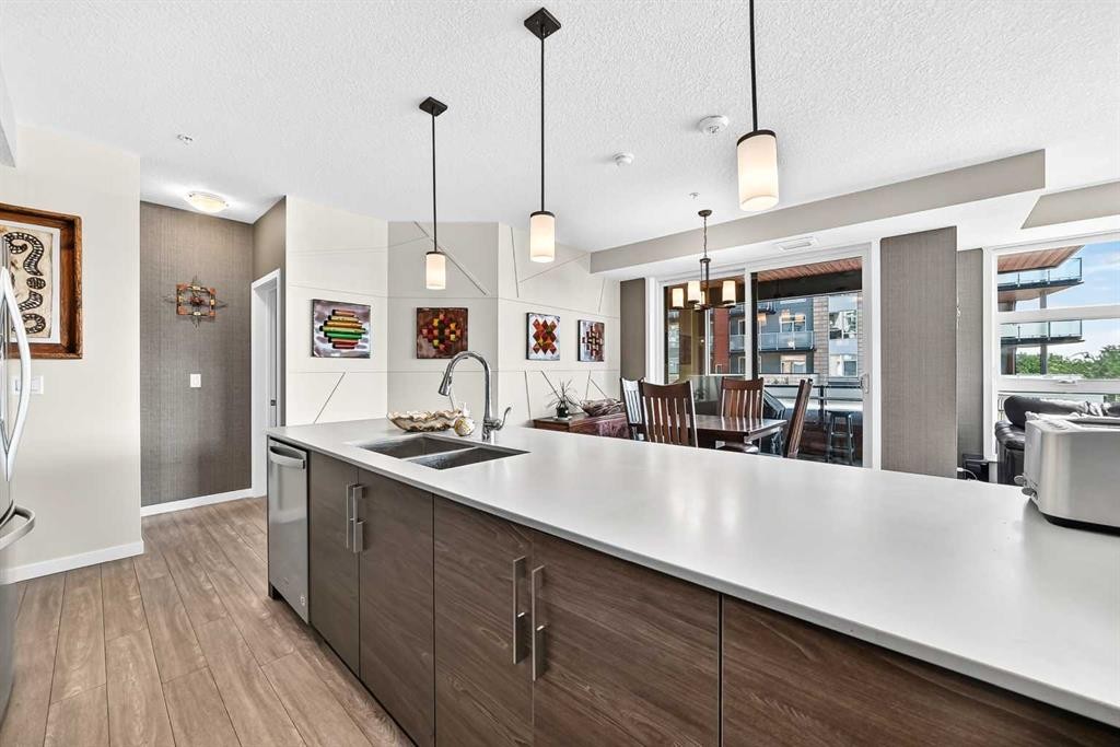 201-122 Mahogany Centre Se, Calgary, AB - Indoor Photo Showing Kitchen With Double Sink