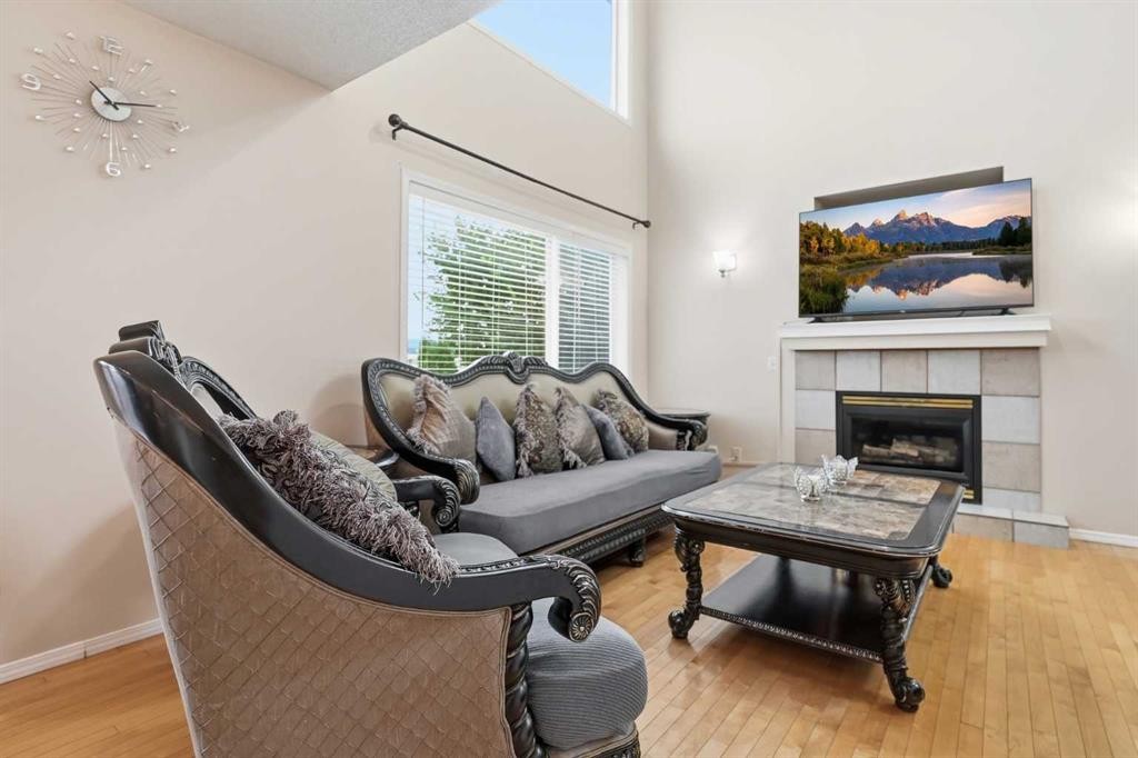 52 Douglas Glen Crescent Se, Calgary, AB - Indoor Photo Showing Living Room With Fireplace