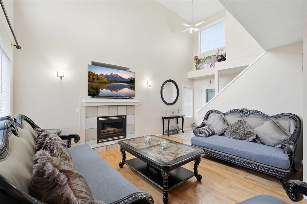 52 Douglas Glen Crescent Se, Calgary, AB - Indoor Photo Showing Living Room With Fireplace