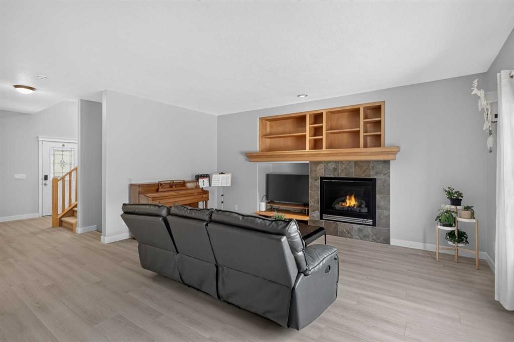 646 Chaparral Drive Se, Calgary, AB - Indoor Photo Showing Living Room With Fireplace