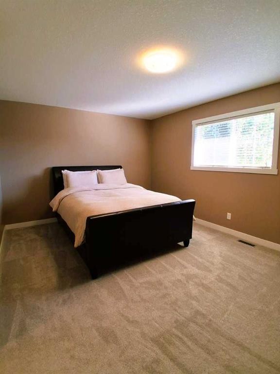 301 Ranch Ridge Meadow, Strathmore, AB - Indoor Photo Showing Bedroom