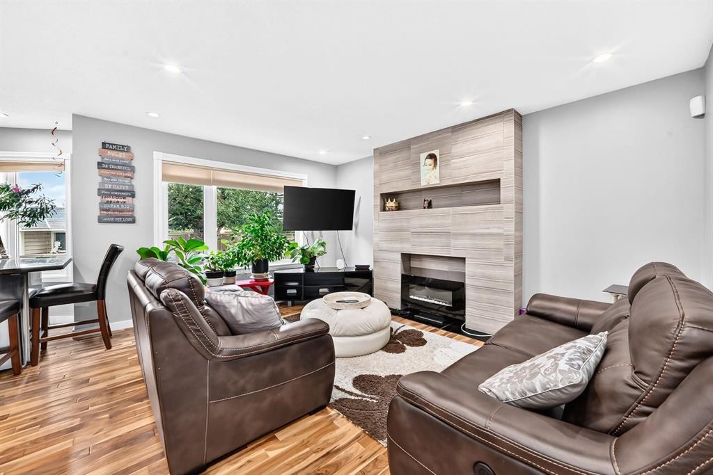 139 Hawkville Close Nw, Calgary, AB - Indoor Photo Showing Living Room With Fireplace
