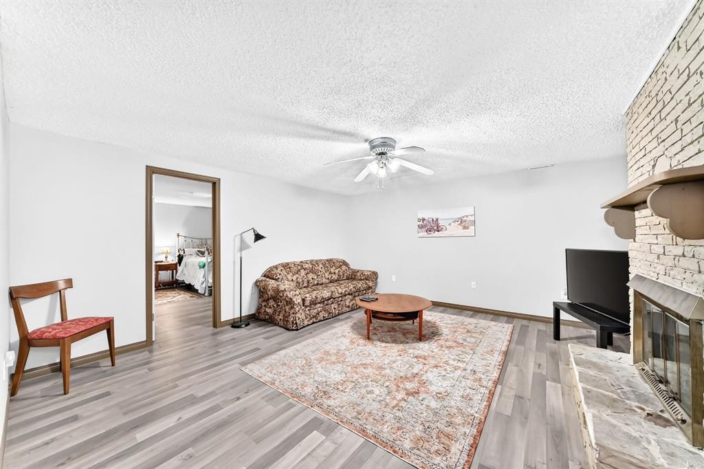 1949 Lytton Crescent Se, Calgary, AB - Indoor Photo Showing Living Room With Fireplace