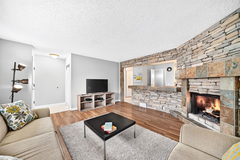 1949 Lytton Crescent Se, Calgary, AB - Indoor Photo Showing Living Room With Fireplace