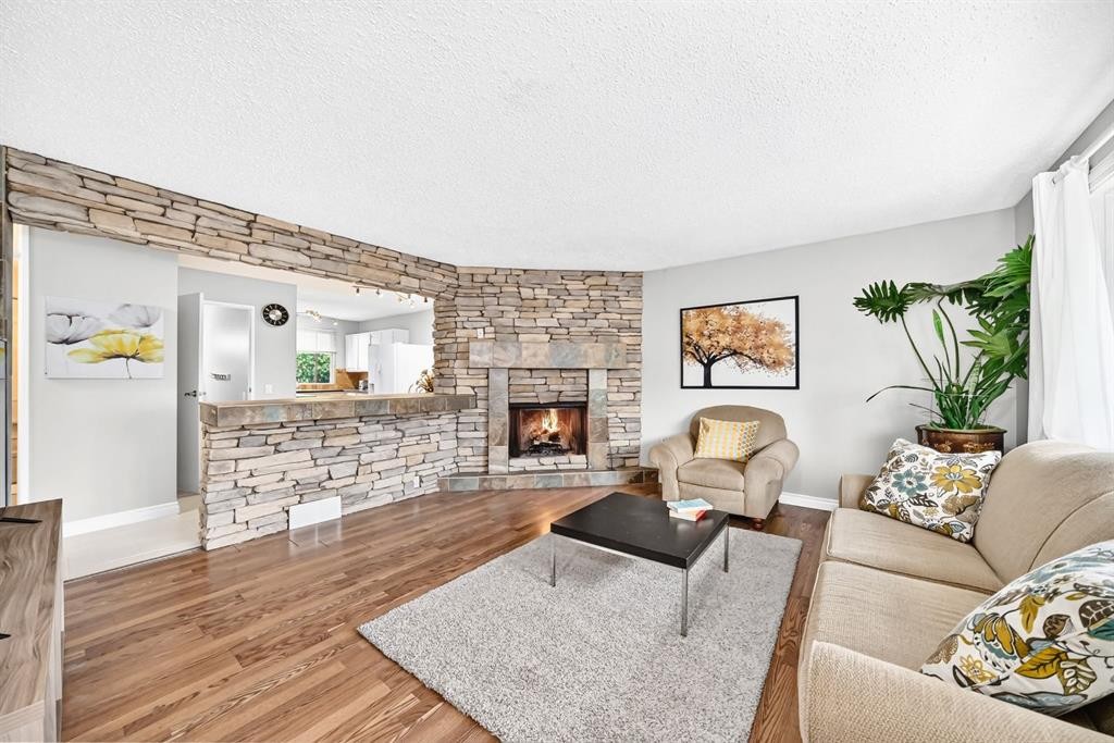 1949 Lytton Crescent Se, Calgary, AB - Indoor Photo Showing Living Room With Fireplace
