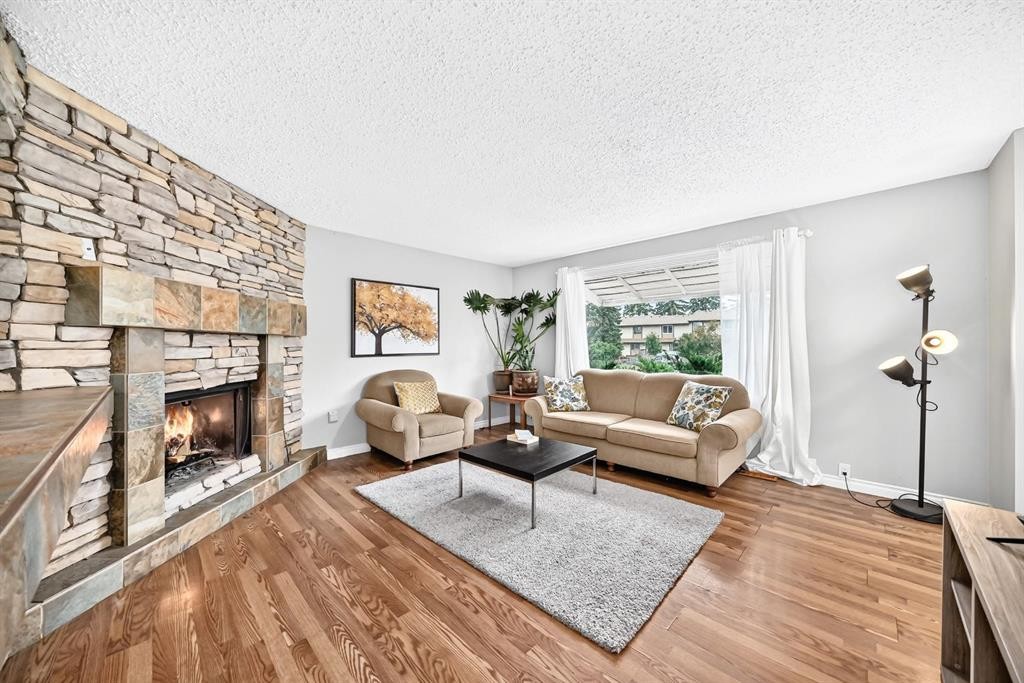 1949 Lytton Crescent Se, Calgary, AB - Indoor Photo Showing Living Room With Fireplace