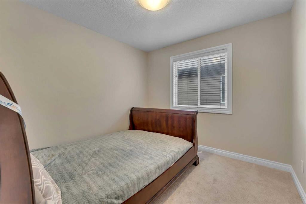 288 Evansborough Way Nw, Calgary, AB - Indoor Photo Showing Bedroom
