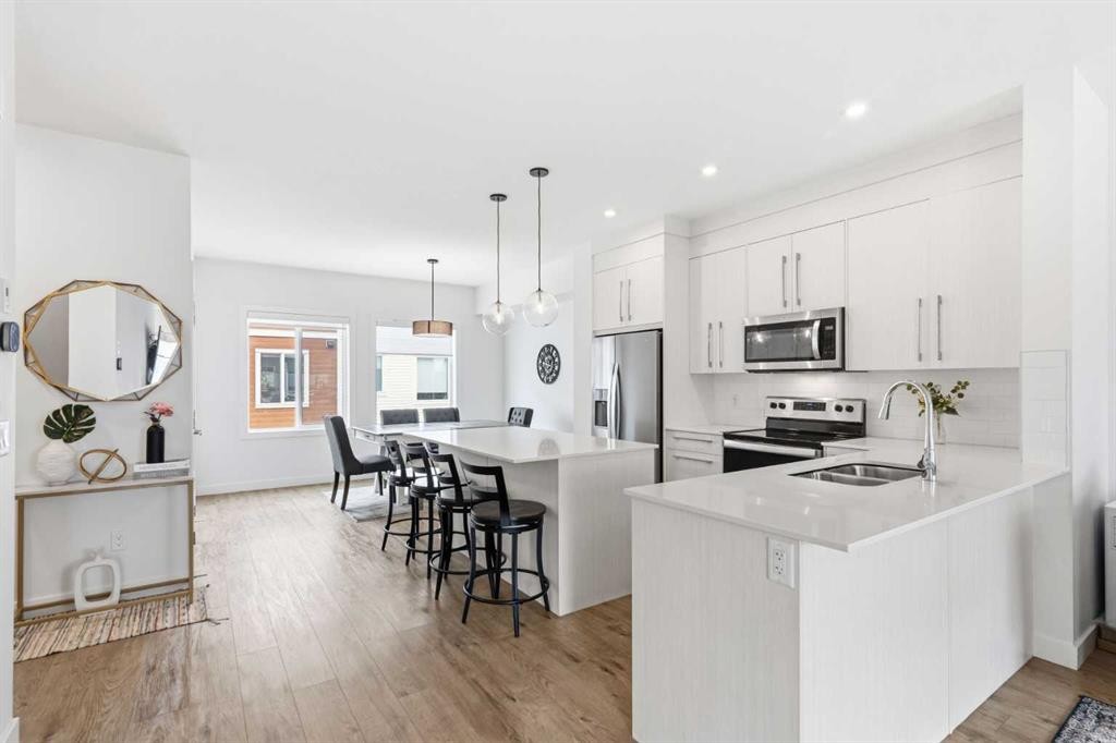 602-335 Creekside Boulevard Sw, Calgary, AB - Indoor Photo Showing Kitchen With Stainless Steel Kitchen With Double Sink With Upgraded Kitchen