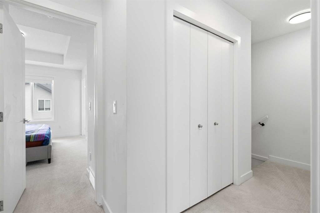 602-335 Creekside Boulevard Sw, Calgary, AB - Indoor Photo Showing Other Room