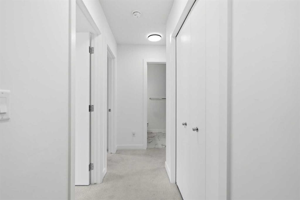 602-335 Creekside Boulevard Sw, Calgary, AB - Indoor Photo Showing Other Room