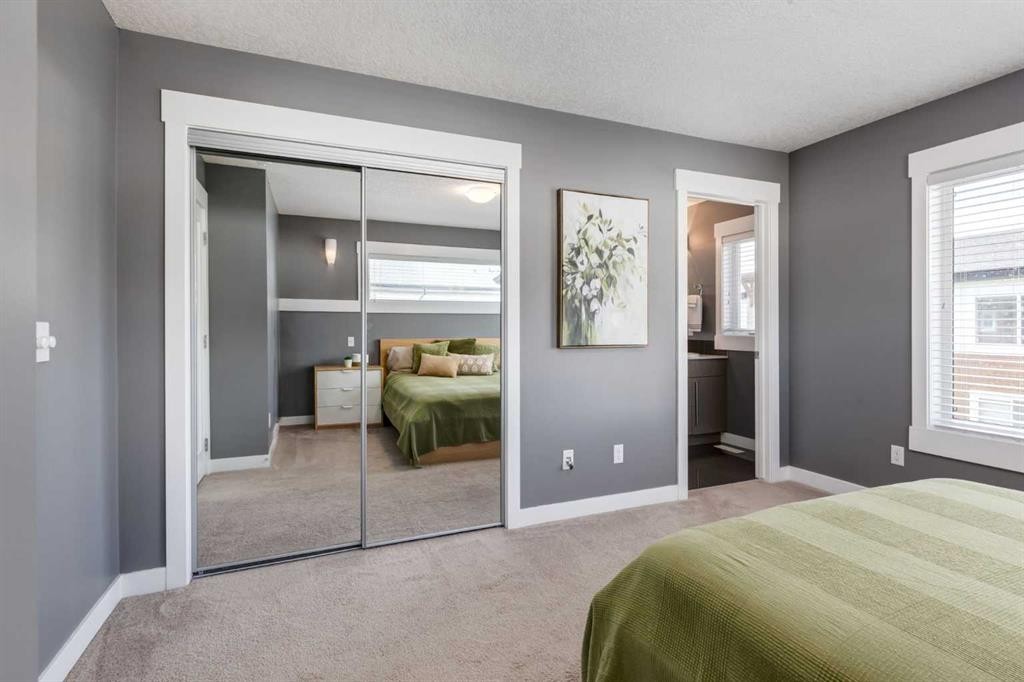 17-111 Rainbow Falls Gate, Chestermere, AB - Indoor Photo Showing Bedroom