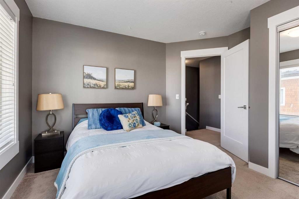 17-111 Rainbow Falls Gate, Chestermere, AB - Indoor Photo Showing Bedroom