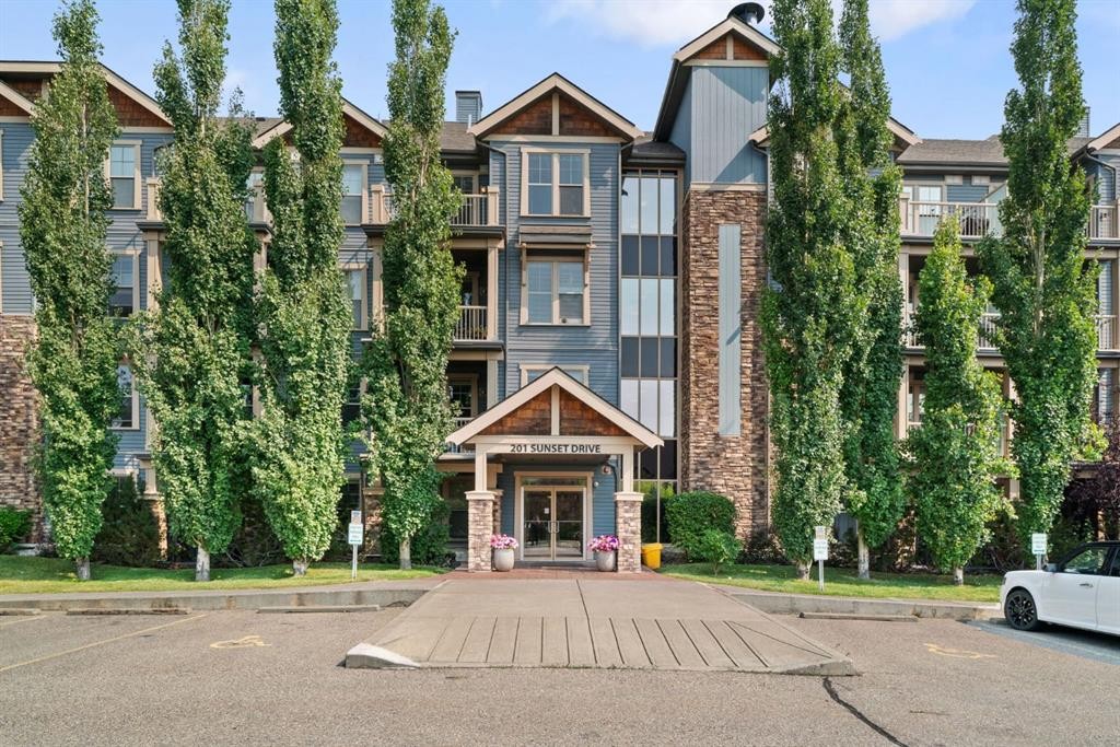 407-201 Sunset Drive, Cochrane, AB - Outdoor With Facade
