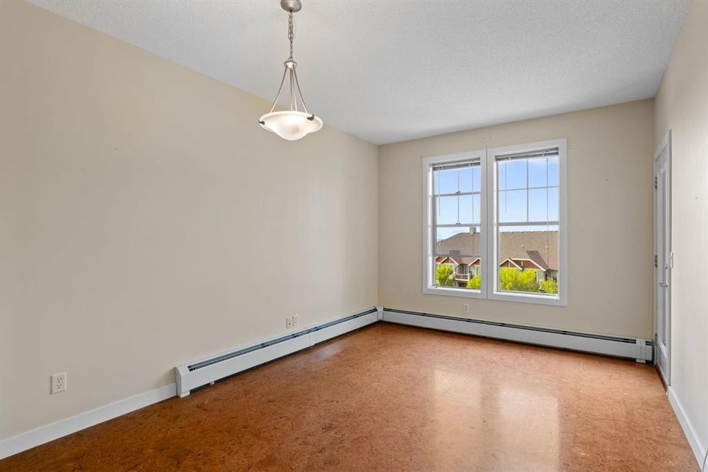 407-201 Sunset Drive, Cochrane, AB - Indoor Photo Showing Other Room