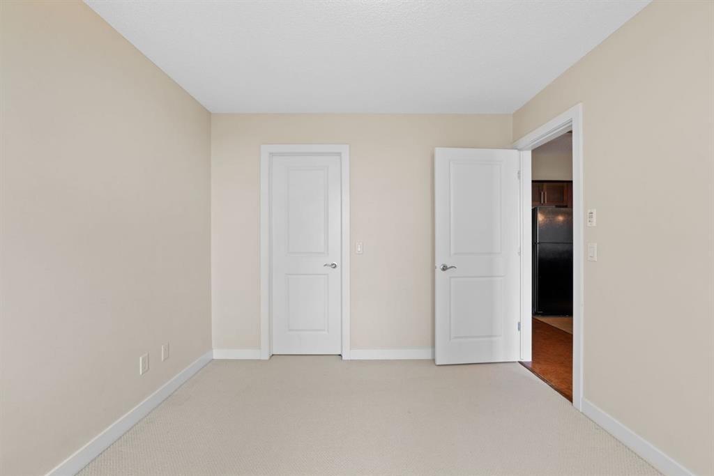 407-201 Sunset Drive, Cochrane, AB - Indoor Photo Showing Other Room