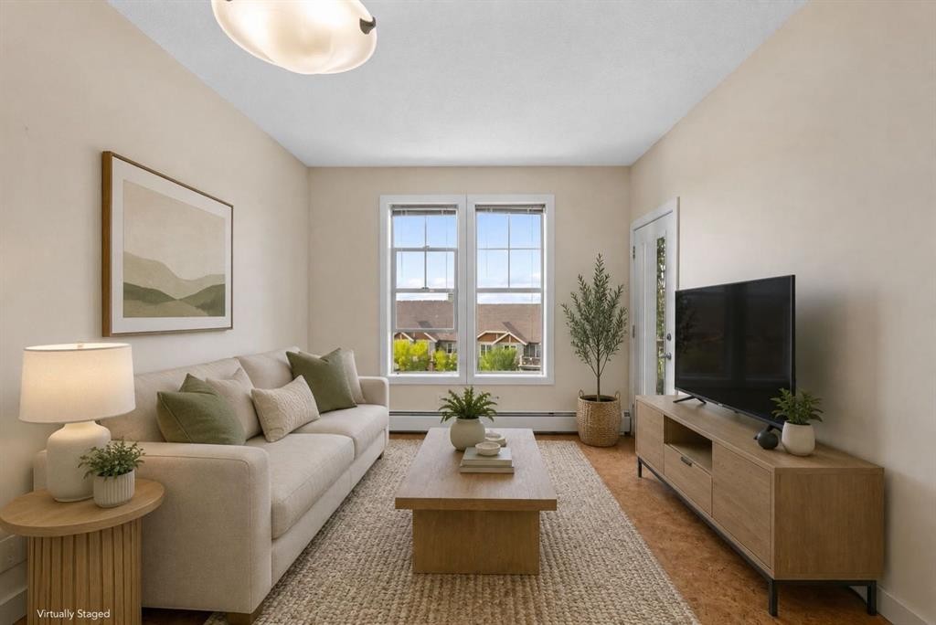 407-201 Sunset Drive, Cochrane, AB - Indoor Photo Showing Living Room