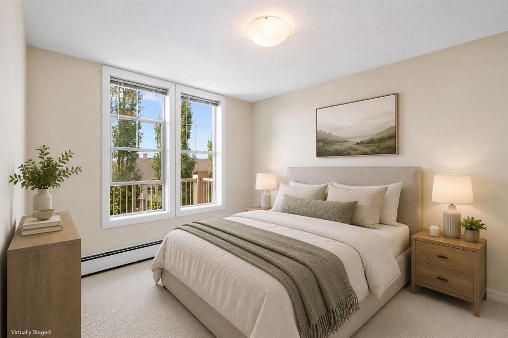 407-201 Sunset Drive, Cochrane, AB - Indoor Photo Showing Bedroom