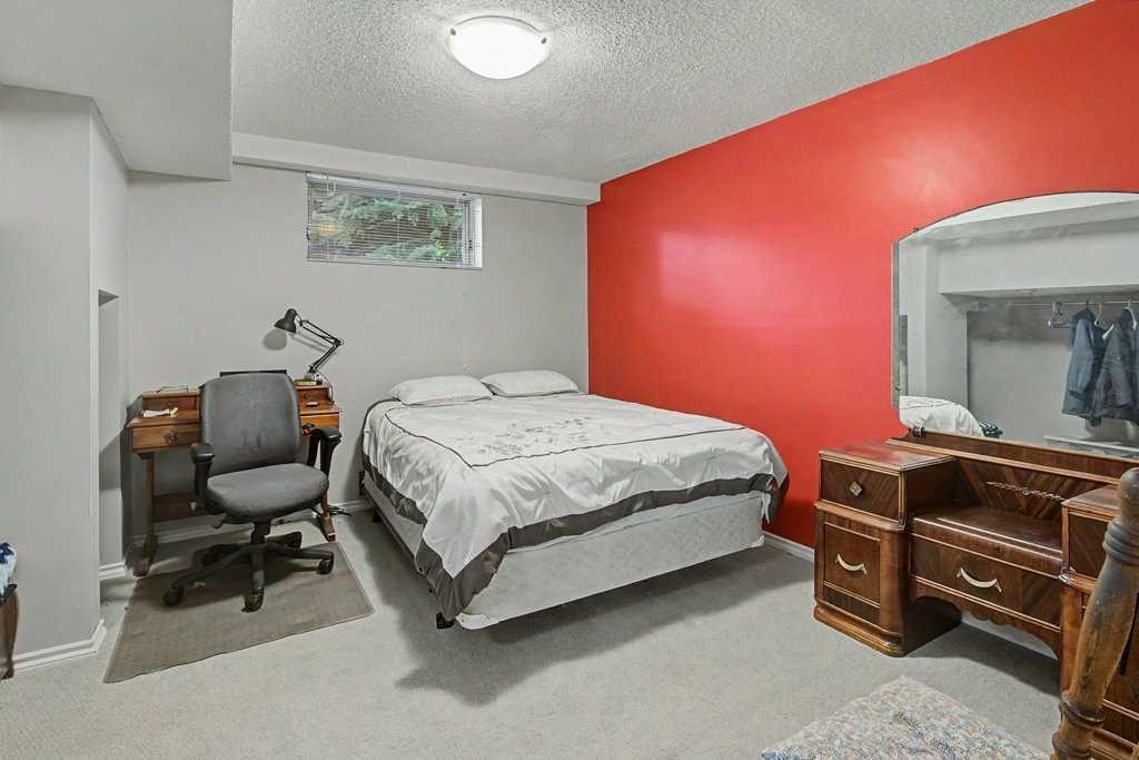 43 Riverside Road Se, Calgary, AB - Indoor Photo Showing Bedroom
