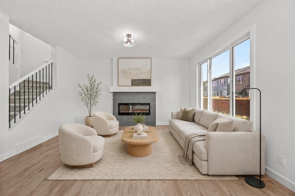 37 Sora Gardens Se, Calgary, AB - Indoor Photo Showing Living Room With Fireplace