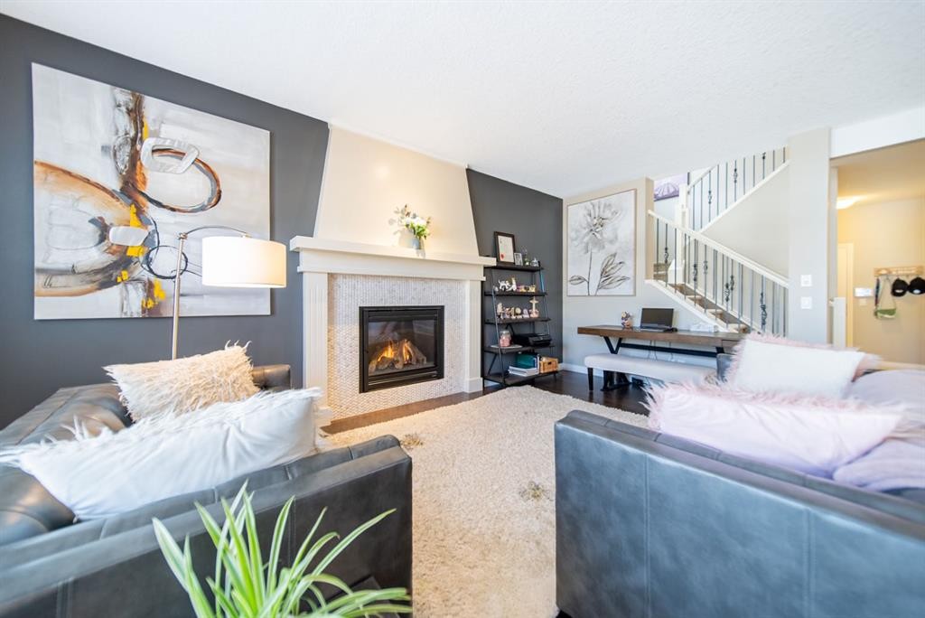 98 Mahogany Passage Se, Calgary, AB - Indoor Photo Showing Living Room With Fireplace