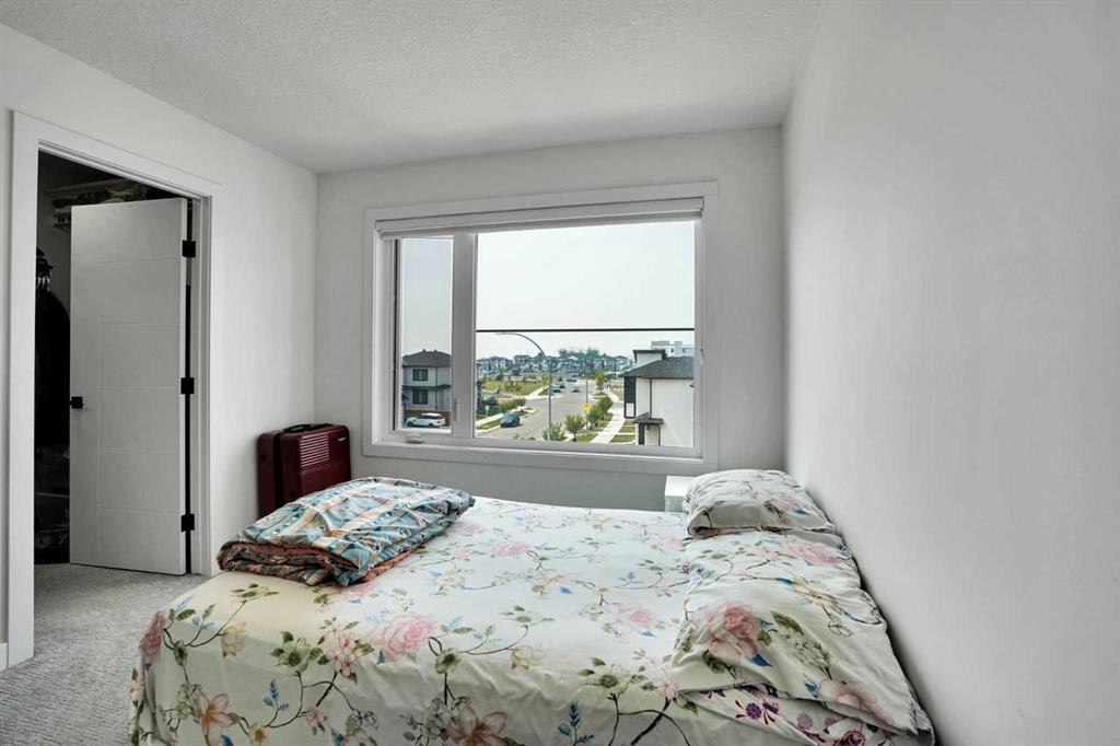 241 Saddlepeace Crescent Ne, Calgary, AB - Indoor Photo Showing Bedroom