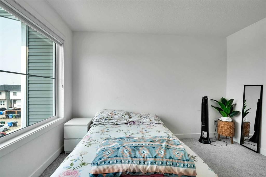 241 Saddlepeace Crescent Ne, Calgary, AB - Indoor Photo Showing Bedroom