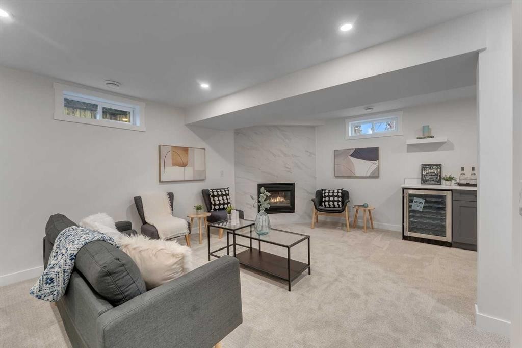 104 Oakmoor Place Sw, Calgary, AB - Indoor Photo Showing Other Room With Fireplace