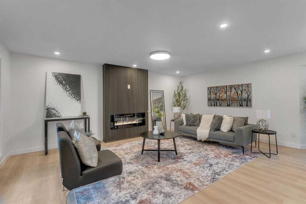 104 Oakmoor Place Sw, Calgary, AB - Indoor Photo Showing Living Room With Fireplace