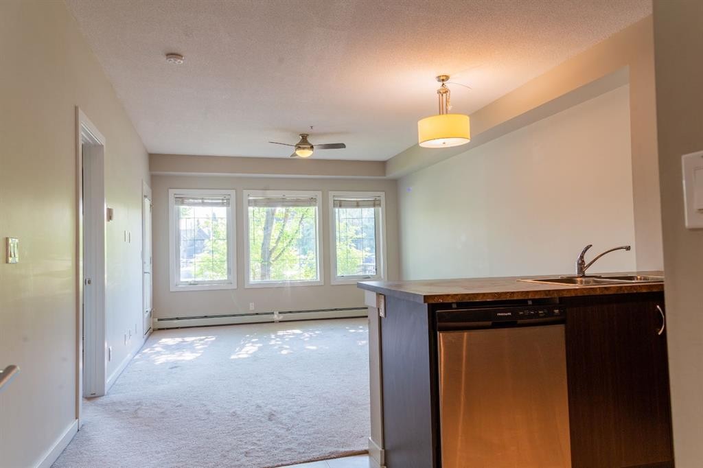 116-100 Cranfield Common Se, Calgary, AB - Indoor Photo Showing Kitchen With Double Sink