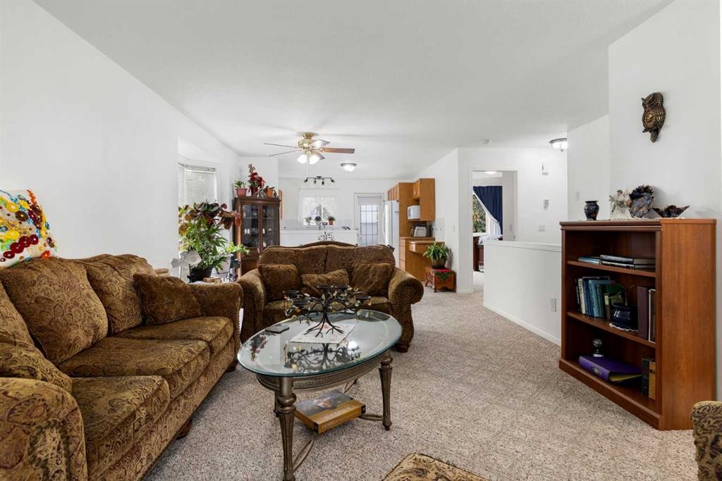 100 Dovista Court Se, Calgary, AB - Indoor Photo Showing Living Room