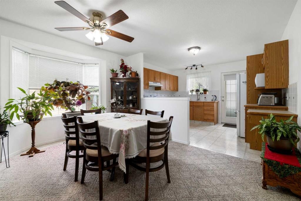 100 Dovista Court Se, Calgary, AB - Indoor Photo Showing Dining Room