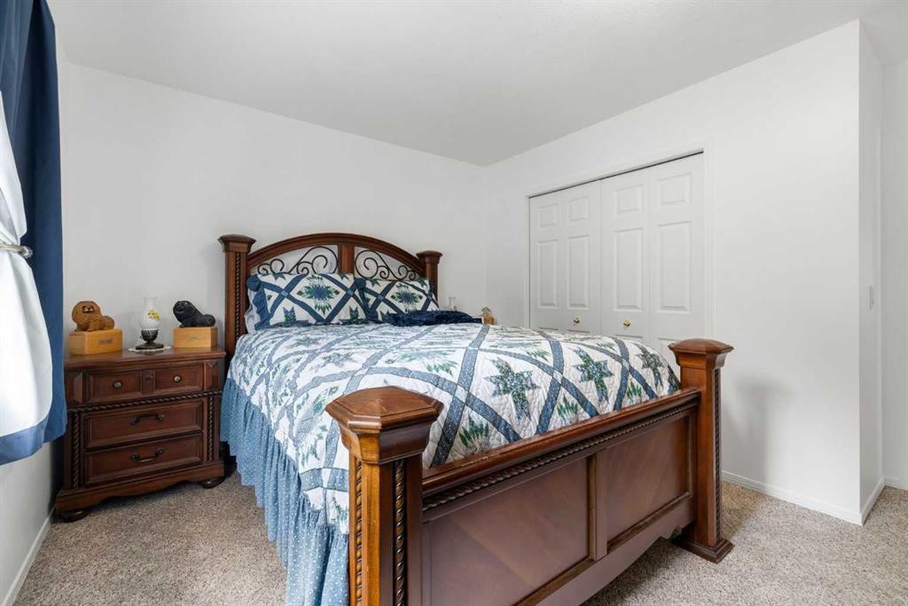 100 Dovista Court Se, Calgary, AB - Indoor Photo Showing Bedroom