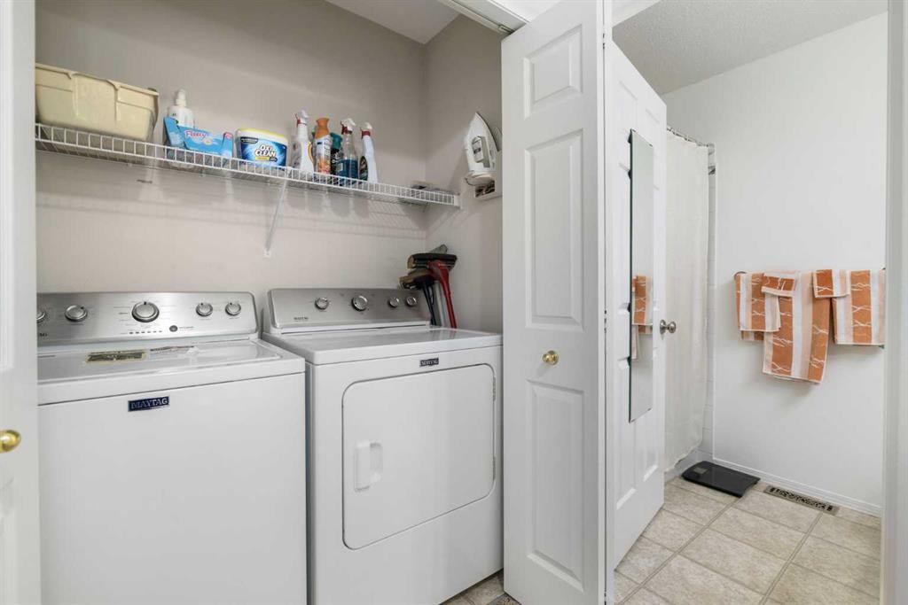 100 Dovista Court Se, Calgary, AB - Indoor Photo Showing Laundry Room