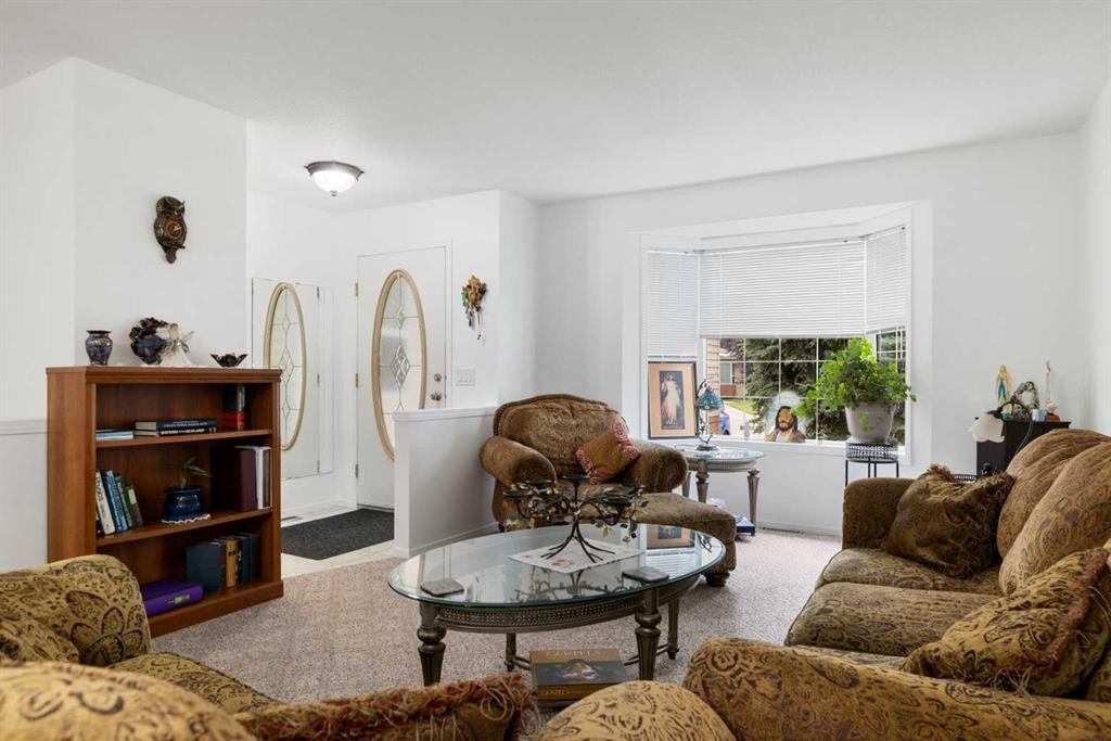 100 Dovista Court Se, Calgary, AB - Indoor Photo Showing Living Room