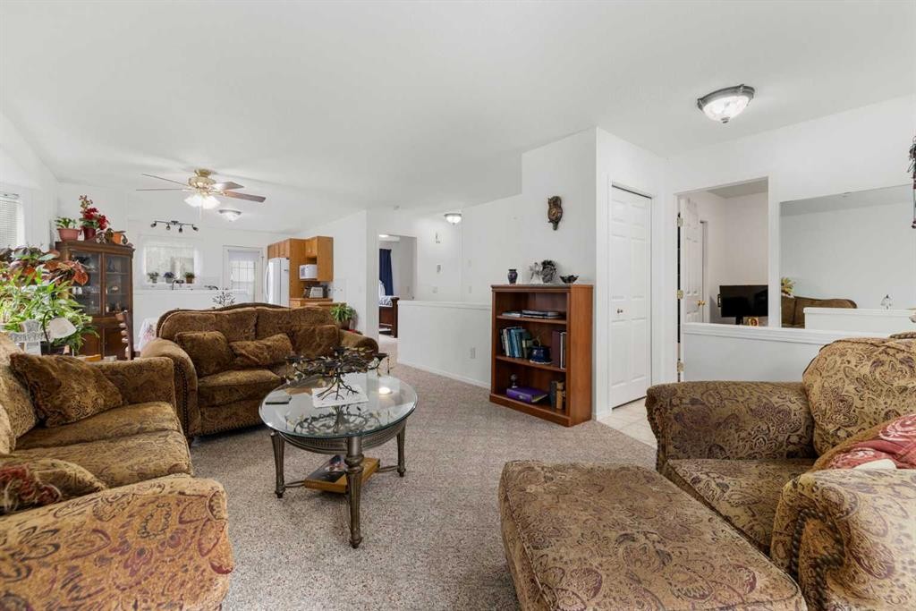 100 Dovista Court Se, Calgary, AB - Indoor Photo Showing Living Room