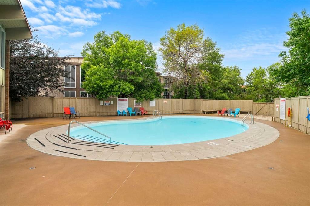 607-8948 Elbow Drive Sw, Calgary, AB - Outdoor With In Ground Pool With Backyard