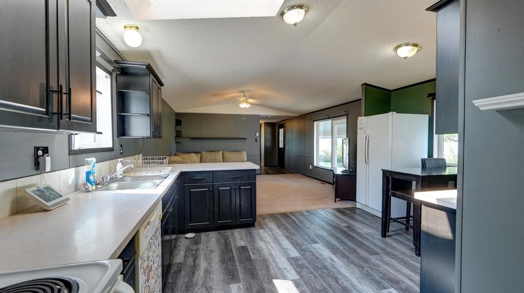 428 57 Avenue West, Claresholm, AB - Indoor Photo Showing Kitchen With Double Sink