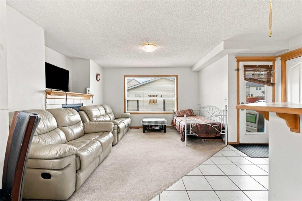 162 Taradale Drive Ne, Calgary, AB - Indoor Photo Showing Living Room