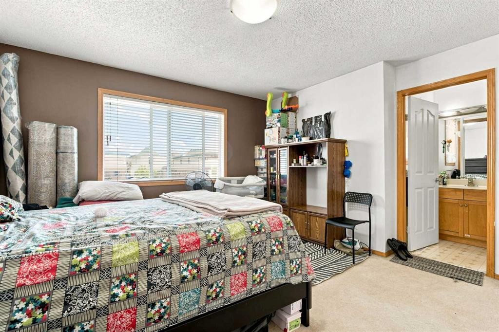 162 Taradale Drive Ne, Calgary, AB - Indoor Photo Showing Bedroom