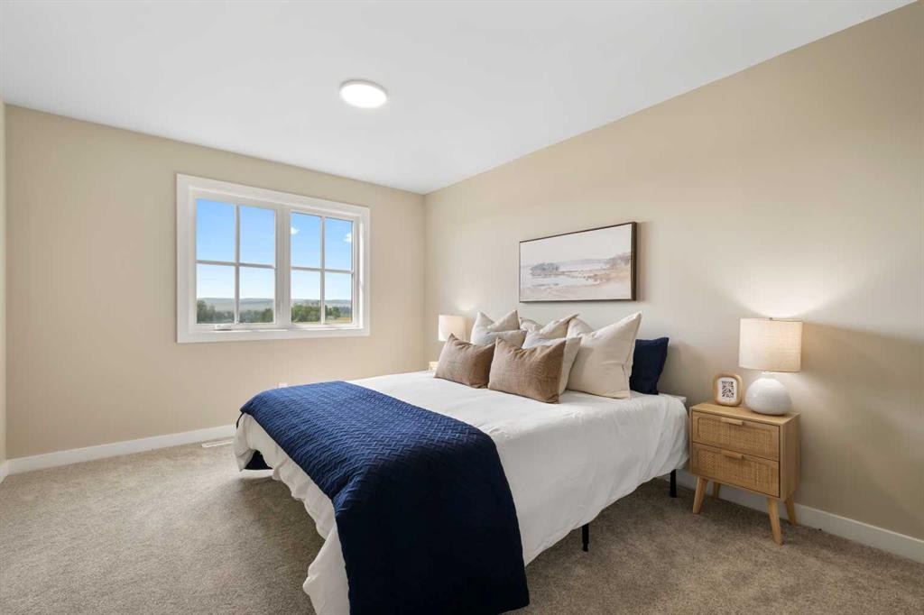 329 Flare Avenue Sw, Diamond Valley, AB - Indoor Photo Showing Bedroom