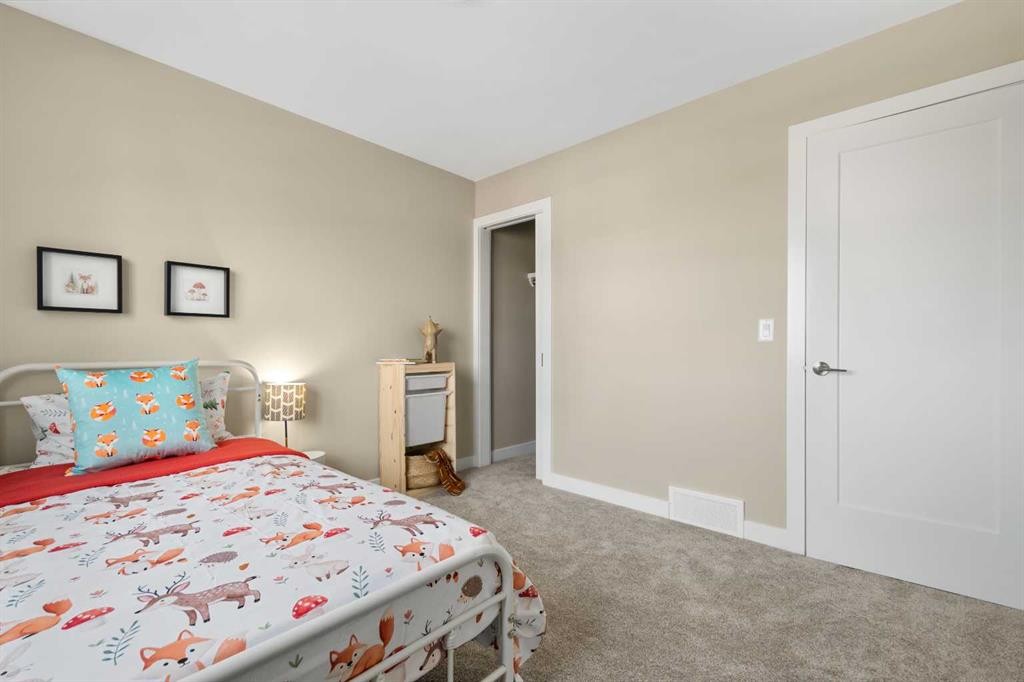 329 Flare Avenue Sw, Diamond Valley, AB - Indoor Photo Showing Bedroom